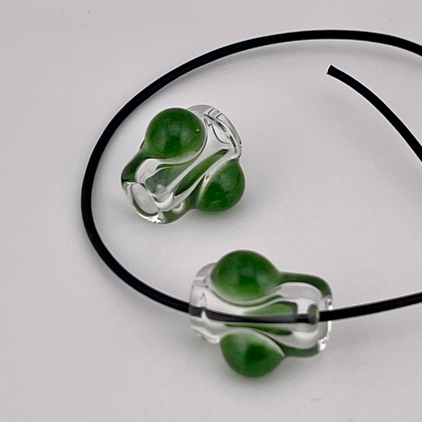 2 Clear beads with Sparkly Green marbles