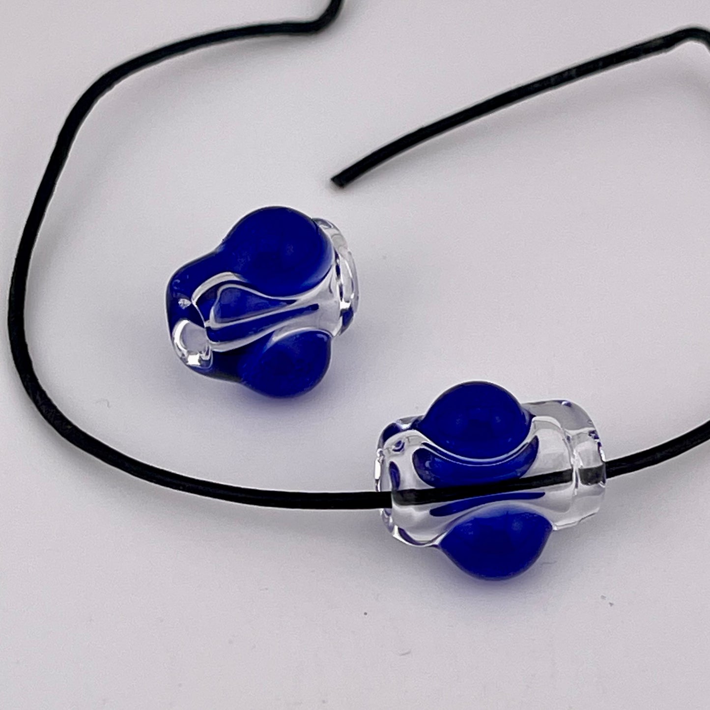 2 Clear beads with Blue marbles