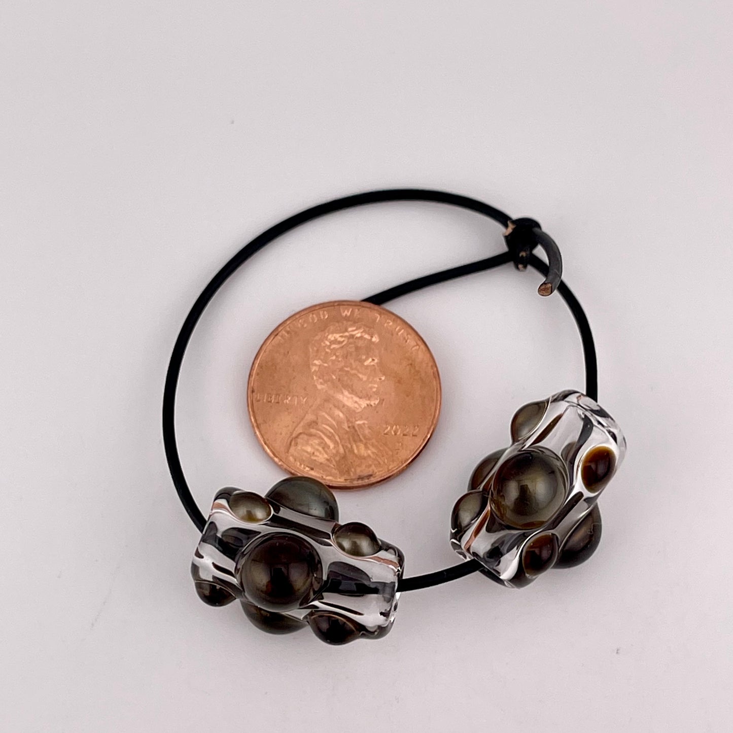 Clear Glass Barrel Bead with Golden Bronze Marbles