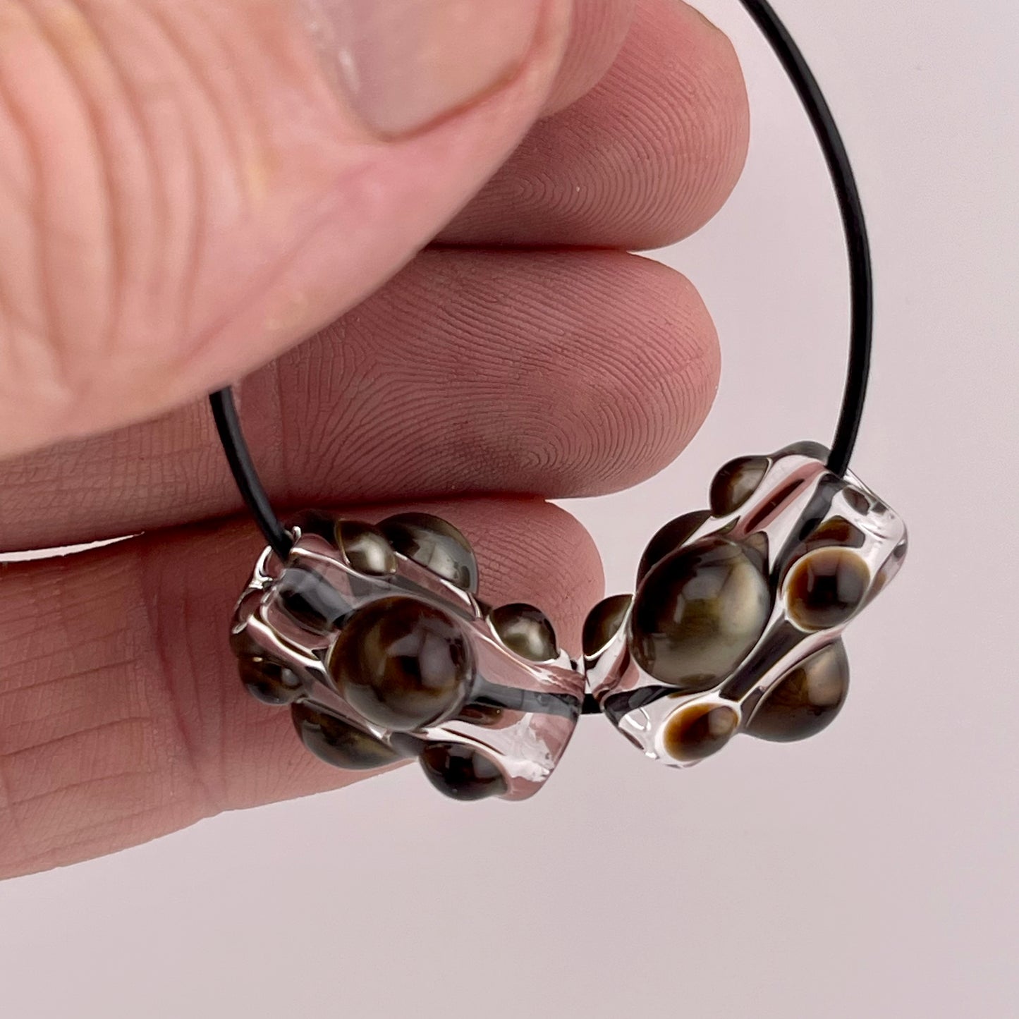 Clear Glass Barrel Bead with Golden Bronze Marbles