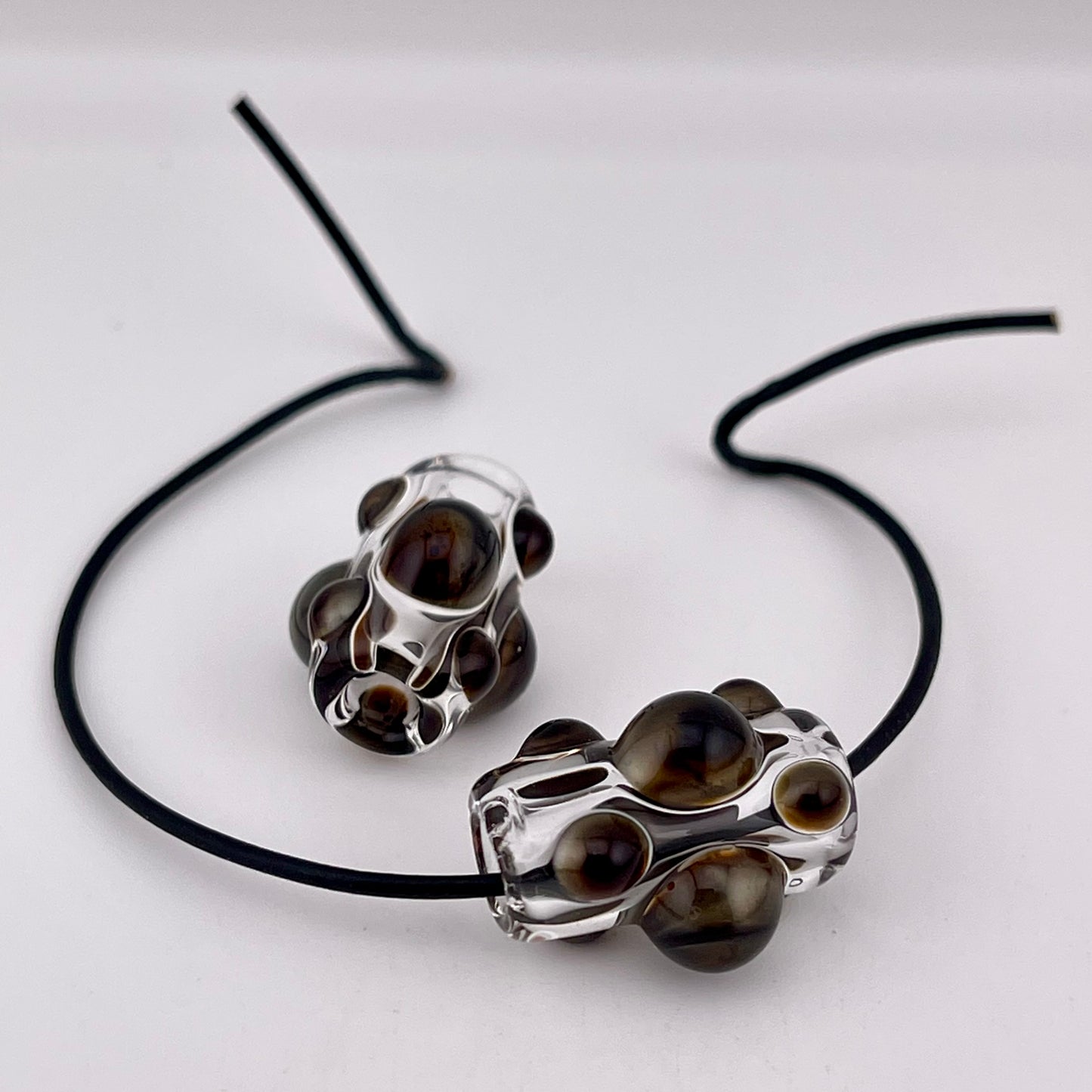 Clear Glass Barrel Bead with Golden Bronze Marbles