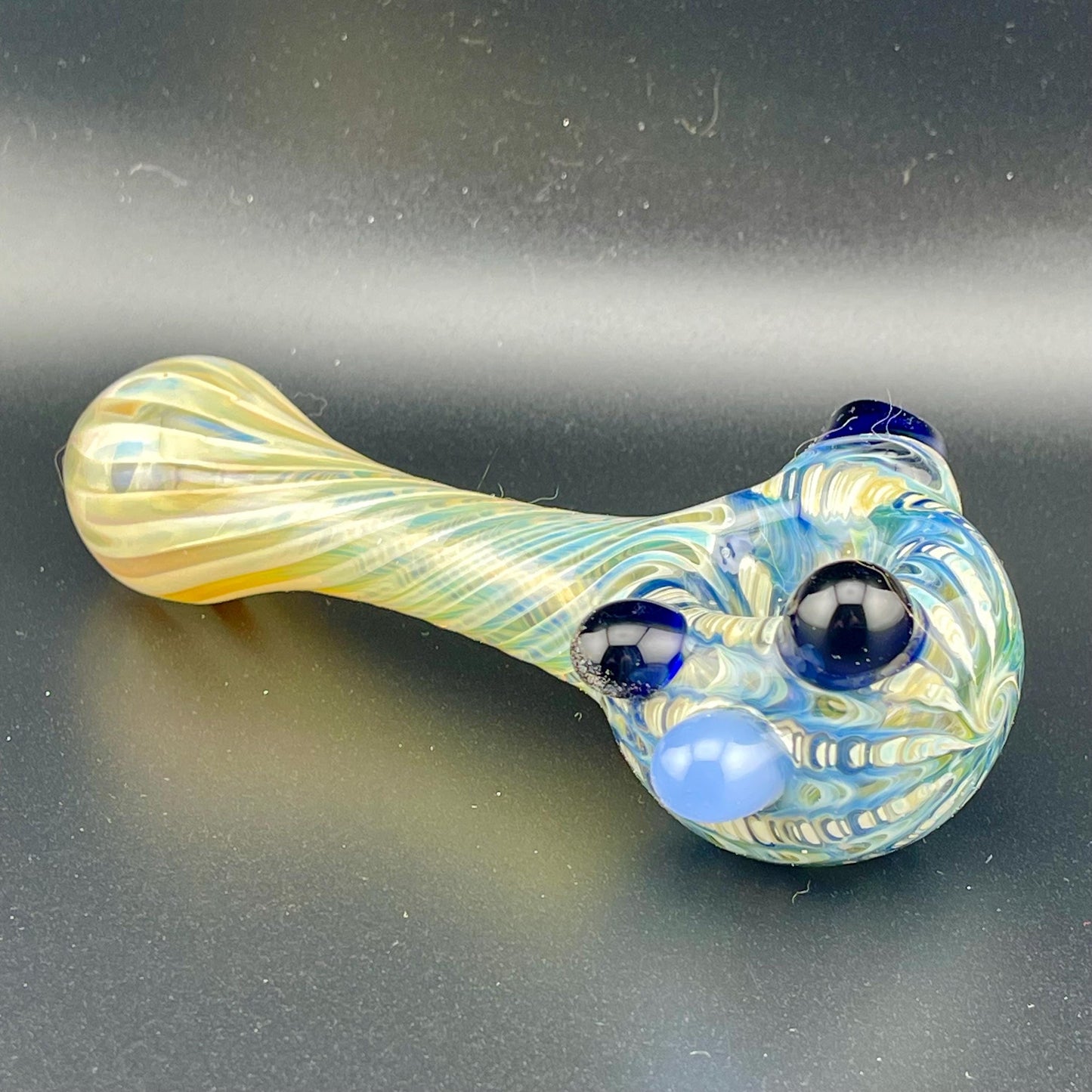 Wrap n Rake Twist Blue and Silver Fumed Spoon Pipe with light blue marbles